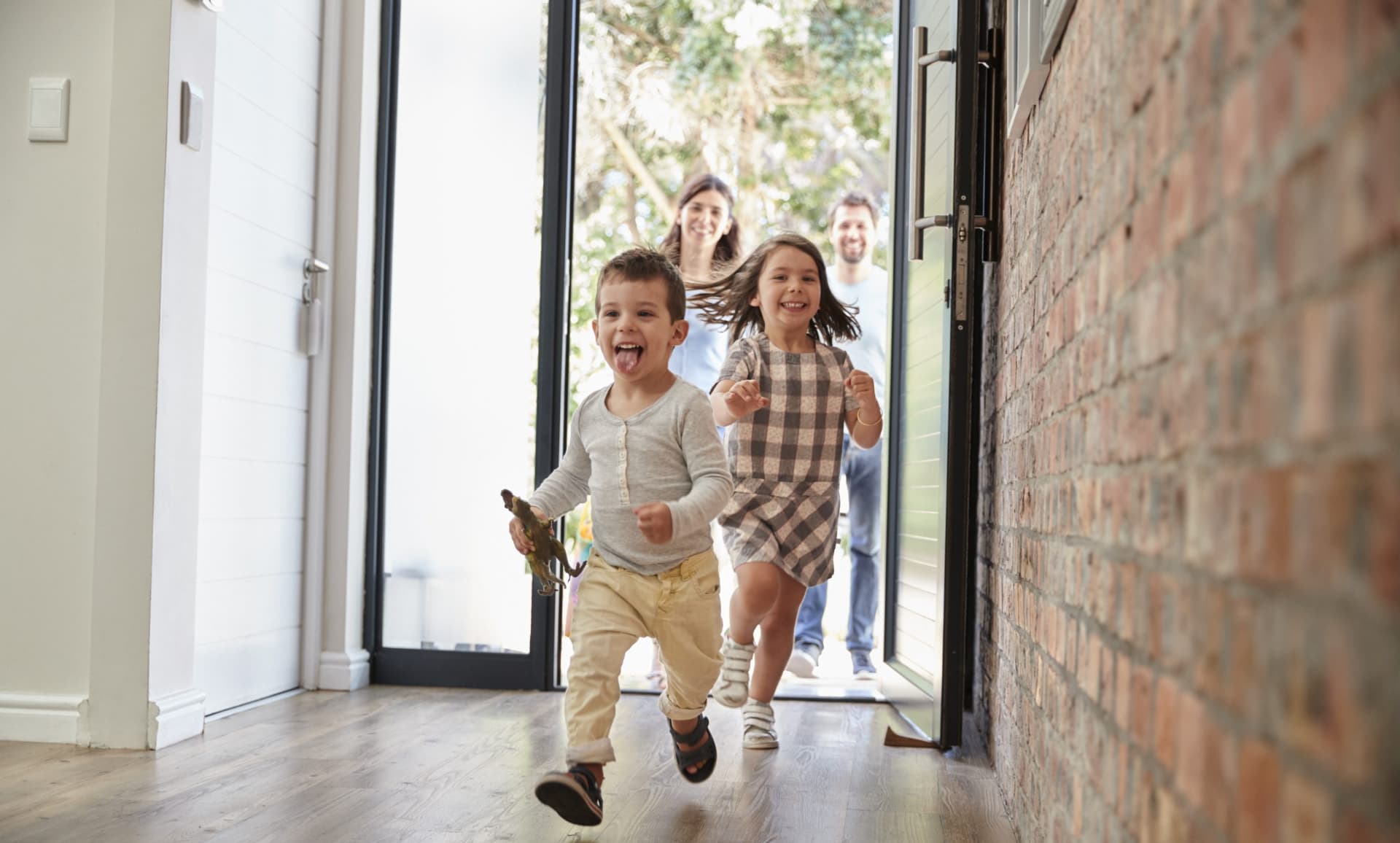 Family walking on wooden floors